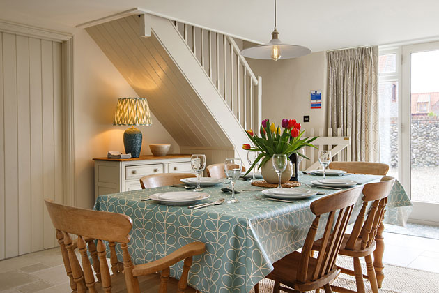 Flintstone Barn Cottage's dining room looking toward stairs