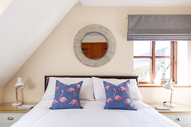 Barnett's Cottage's king-size bedroom, view down bed from its foot