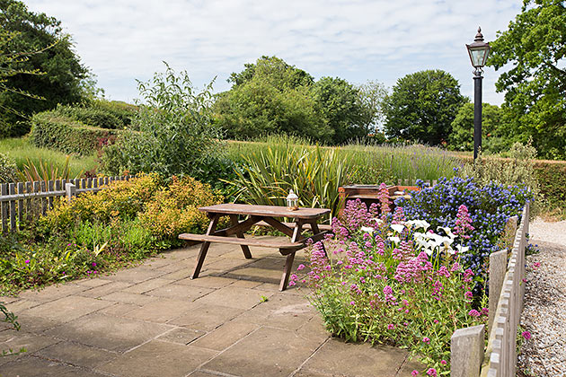 Home Farm End Cottage's patio/garden looking away from the cottage