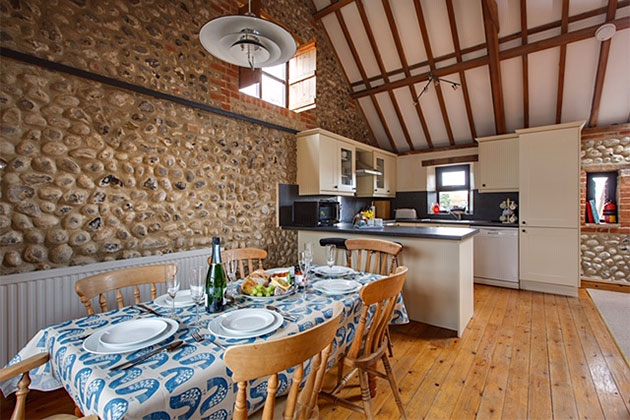 Old Flint Barn Cottage's diner part of its kitchen diner