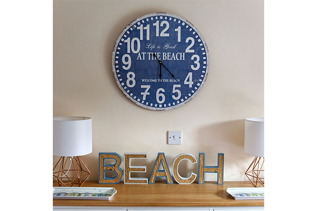 Old Flint Barn Cottage's twin bedroom clock and mantelpiece detail