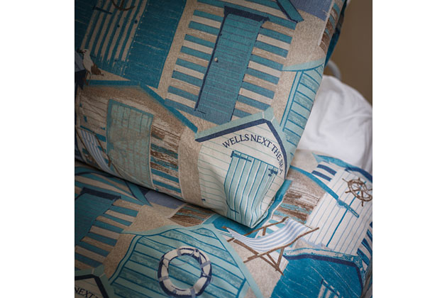 Plover Cottage's bedroom with bunk beds - close-up of linen