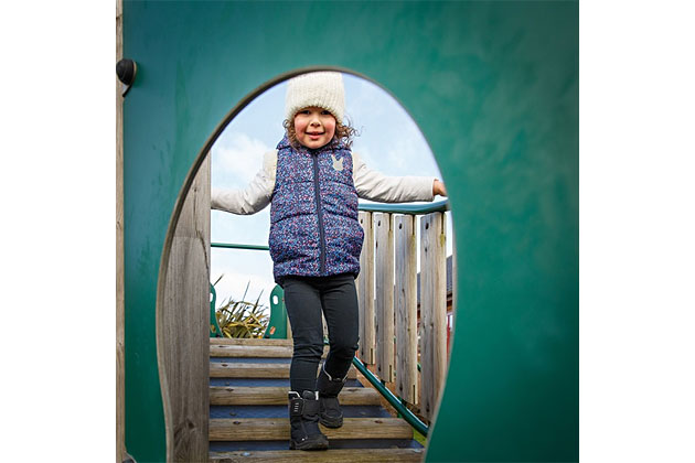 Toddler enjoying the toddler slide